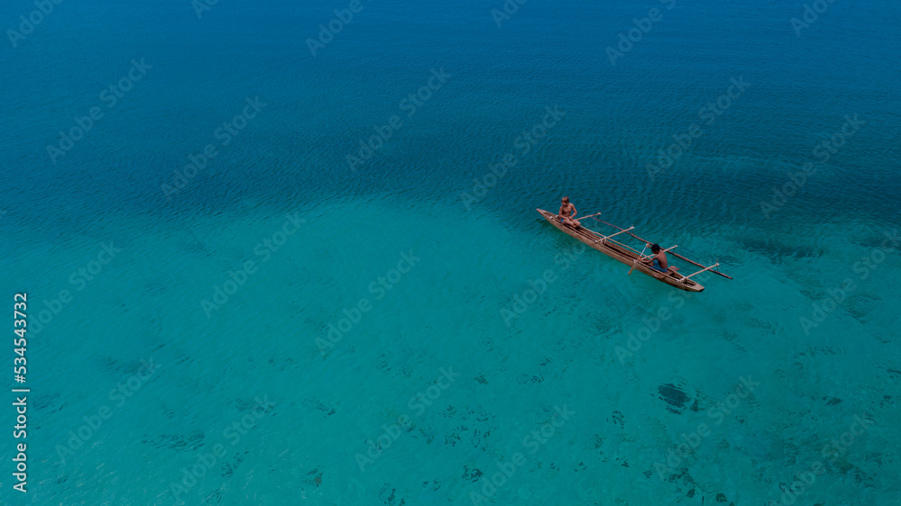 Boat in the middle of the blue sea, location in Pasir Putih Manokwari, West Papua Province