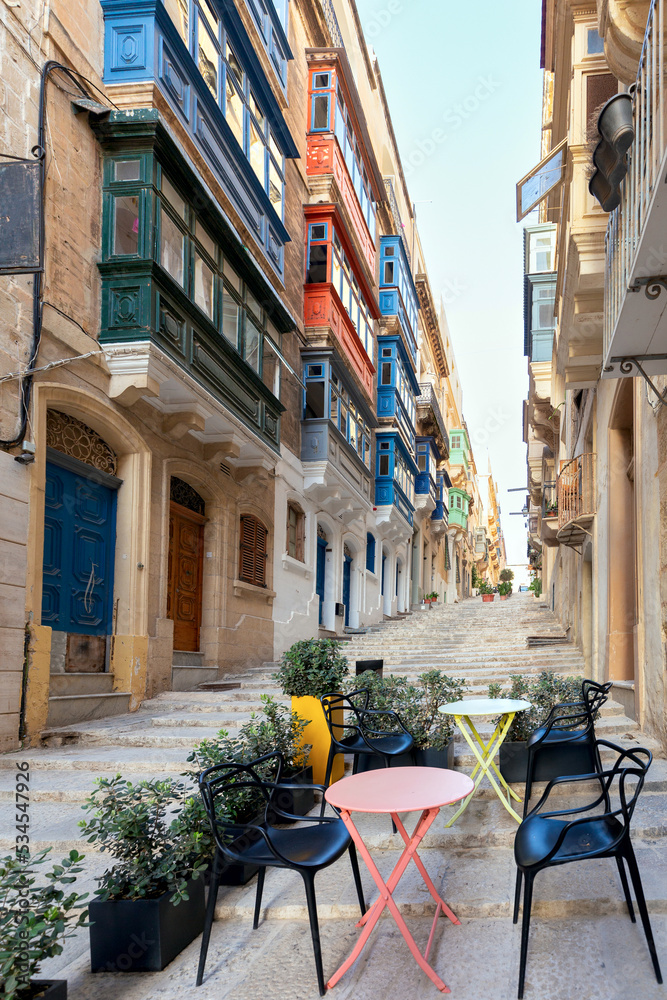 Valletta. Old stone traditional medieval street on a sunny day.