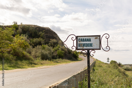 Signpost with Romanian text: Cabana Belvedere. In  English translate like: Observation deck. The pointer is located along the route E584, Cahul region, Moldova photo