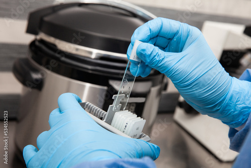 Photography Scientist preparing slides with tissue samples for immunohistochemistry assay
