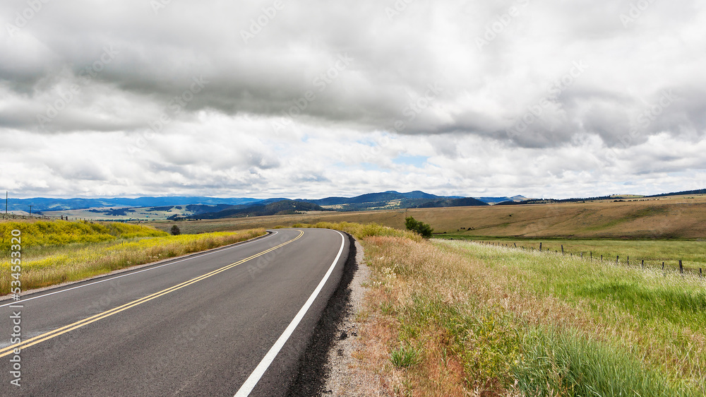 Road running through grassland. Road running through grassland.