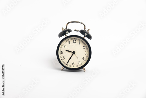 black vintage alarm clock isolated on white background, Time concept, 9:35 o'clock. Morning, reminder.
