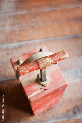 Dynamite Detonator, red box and a metal handle, a plunger to detonate dynamite in quarrying. photo