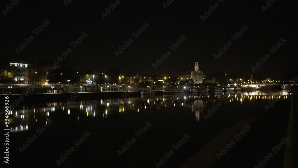 night view of the Guadalquivir river the golden tower in seville night view of the Guadalquivir river the golden tower in seville