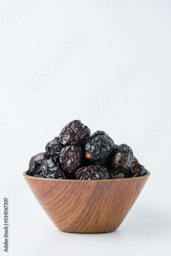 Delicious ajwa dates ( kurma nabi ), Much sought after during the month of Ramadan as a dish for breaking the fast, ramadhan kareem, empty space, copy space.