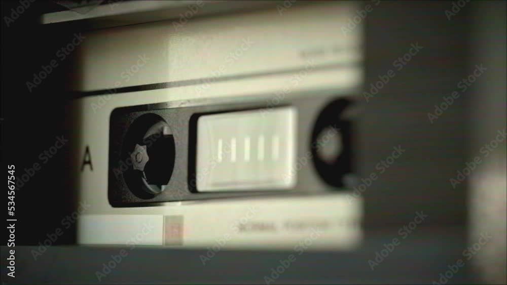 Retro radio tape recorder, audio cassette close-up. Listening to music, old radio boombox player, searching channel. Retro radio tape recorder, audio cassette close-up. Listening to music, old radio boombox player, searching channel.