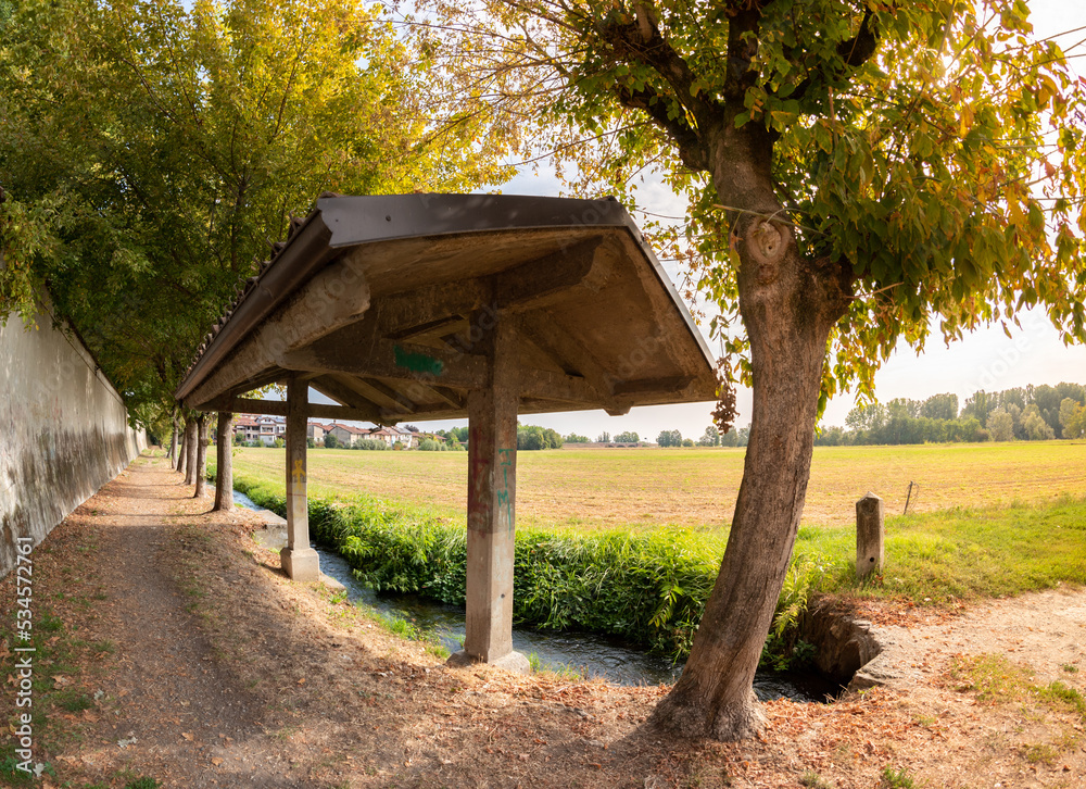 Ancient washhouse with canopy in the countryside in Villafranca Piemonte, Piedmont, Italy Ancient washhouse with canopy in the countryside in Villafranca Piemonte, Piedmont, Italy