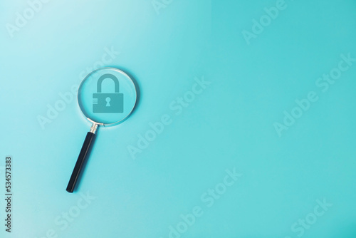 magnifying glass with key icon security information protection concept