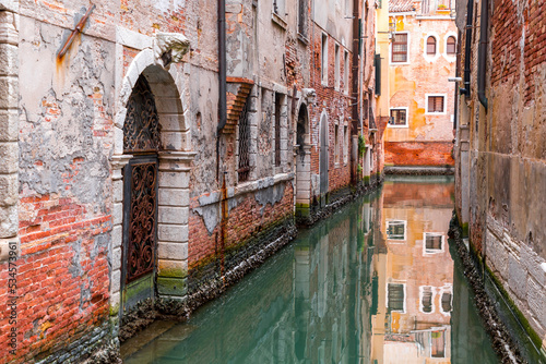Beautiful canals and traditional Venetian buildings in Venice, Italy © EnginKorkmaz