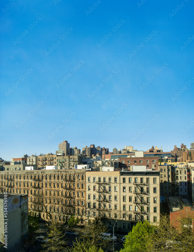 Spanish Harlem New York City building on a clear blue sky day