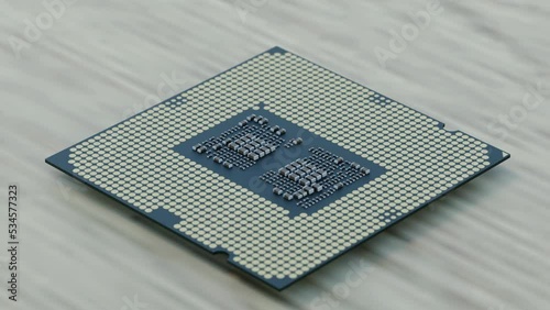 3D rendered video of a modern CPU microprocessor on a table desk