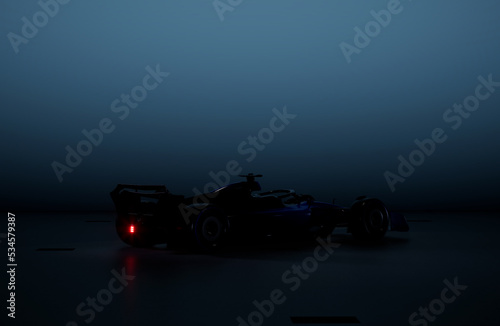 Silhouette of a modern generic sports racing car standing in a dark garage. 3d rendering © supamotion
