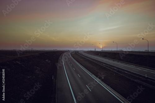 Road to sunset - highways, two lanes with a turn © MushroomsArtTwo