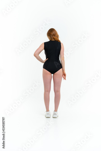 model size posing bodysuit on white background © sutulastock