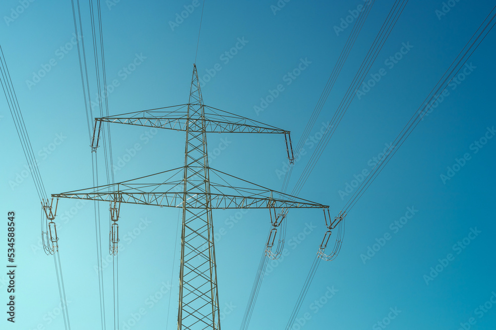 High voltage electrical power towers or pylons and wire lines in