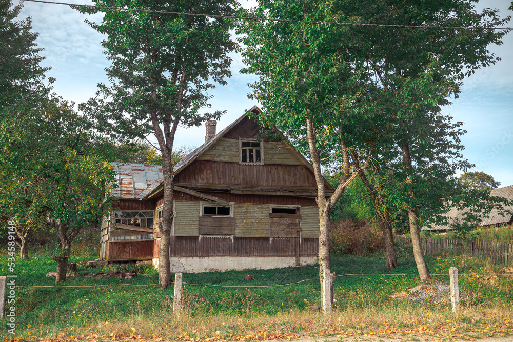 an old abandoned house with boarded up windows with wooden boards an old abandoned house with boarded up windows with wooden boards
