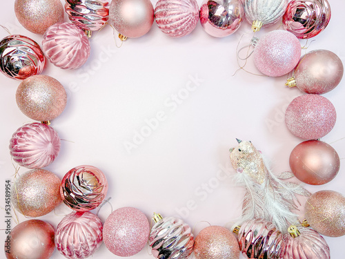 Christmas composition. Christmas balls, pink and silver decorations on a white background. Flat lay, top view, copy space.