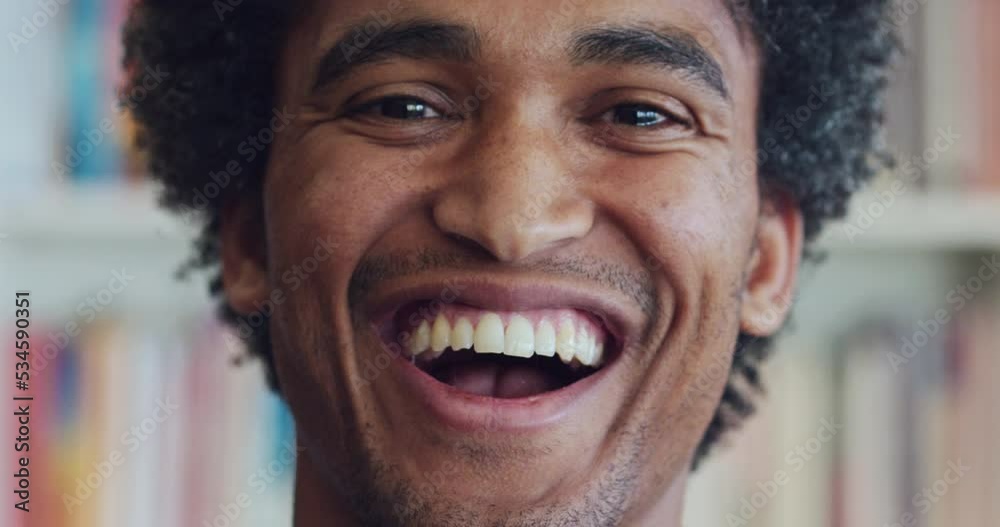 Macro, portrait and smile on face of man in Brazil, at library or study in home. Black man, happy and laugh, in bookstore or house, for closeup or zoom in comic, funny moment after joke and laughing