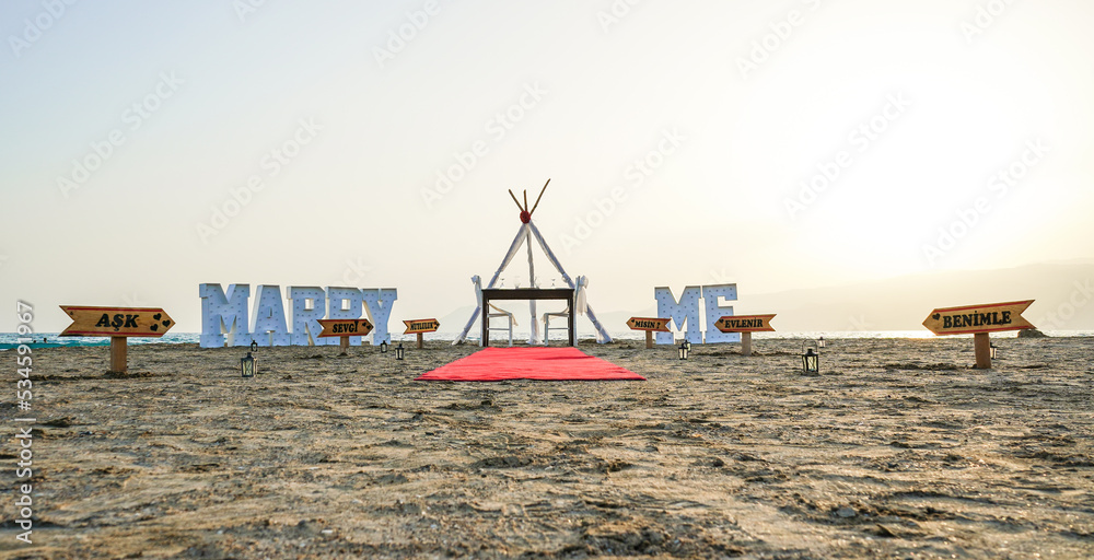 Valentina's day romantic marry me marriage proposal idea at beach sand