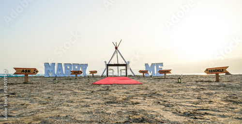 Valentina's day romantic marry me marriage proposal idea at beach sand © 7