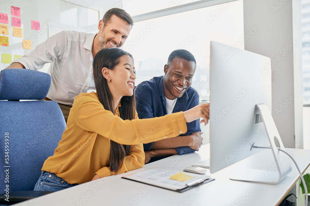 Group of diverse business people working together on project. Three colleagues working at office on computer