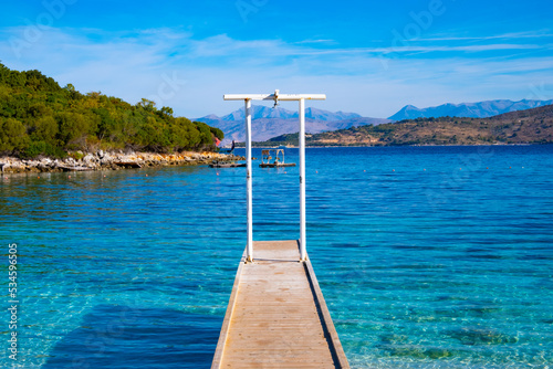 Wooden pier on the beach in Ksamil in Albania