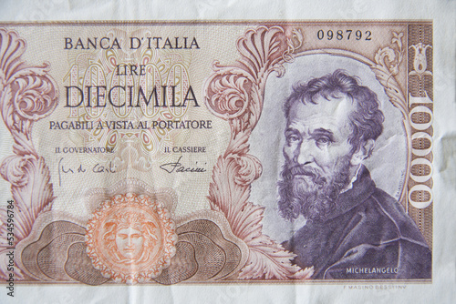 Vintage Italian banknote dated 1968. Detail 10,000 lira with portrait of Michelangelo, Italian collectible paper money. photo