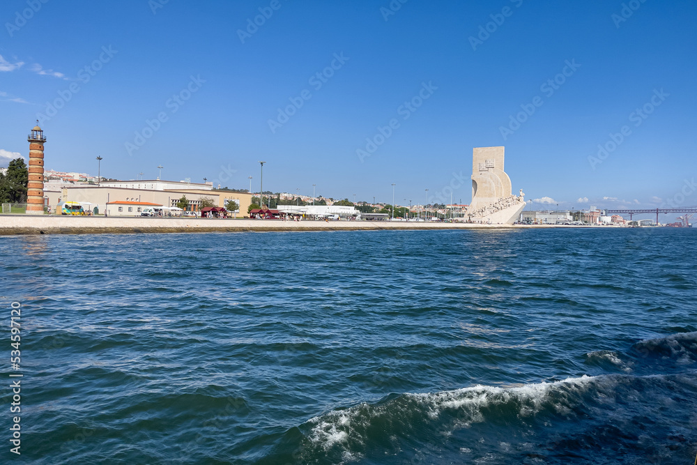 View from a tour boat over the Monument of the discoveries in Lisbon