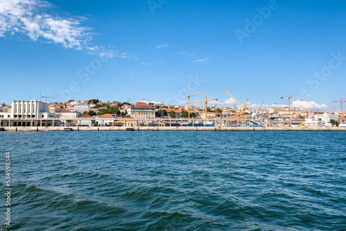 Fototapeta Naklejka Na Ścianę i Meble -  View from a tour boat passing by the Port of Lisbon