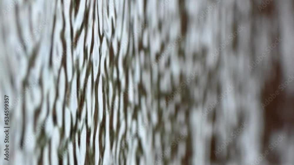 Vertical video. Single drops of slow rain. Water falling into a puddle in slow motion. Circular waves on water. Vertical video. Single drops of slow rain. Water falling into a puddle in slow motion. Circular waves on water.