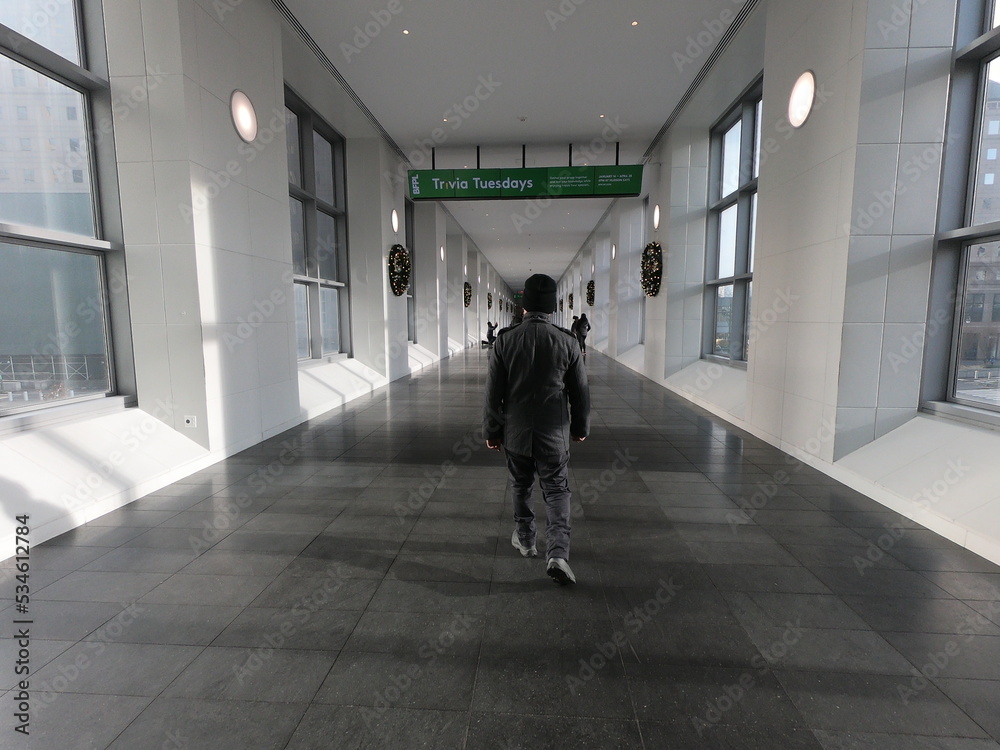 person walking in a corridor person walking in a corridor