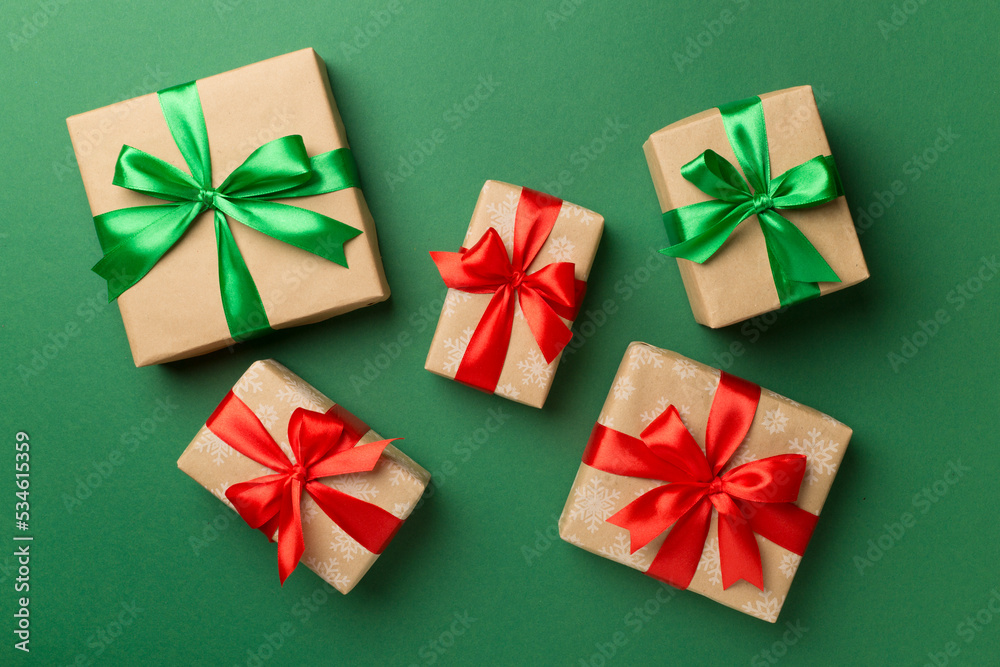 Christmas gift boxes on color background, top view Christmas gift boxes on color background, top view