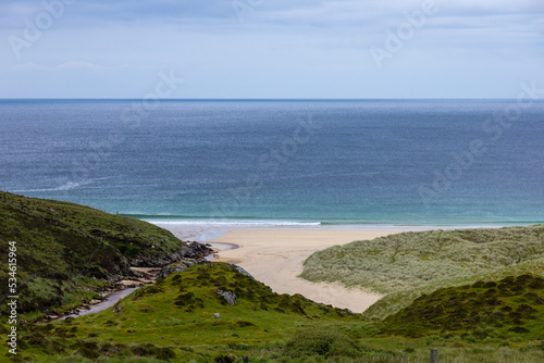 The beautiful, scenic landscape in Sgarasta Mhor Beach, Isle of Harris, in a windy, cloudy summer day.