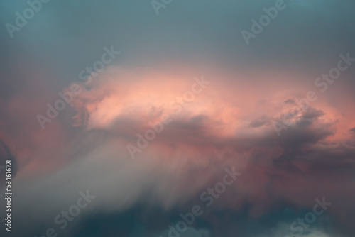 Dramatic pink summer storm clouds