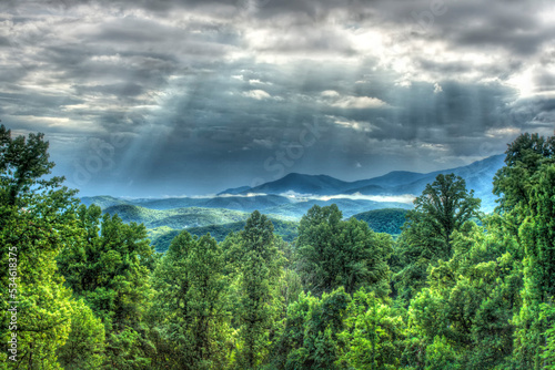 God rays fill the sky on a partially cloudy morning at Maloney Point Overlook Great Smoky Mountains Tennessee 
