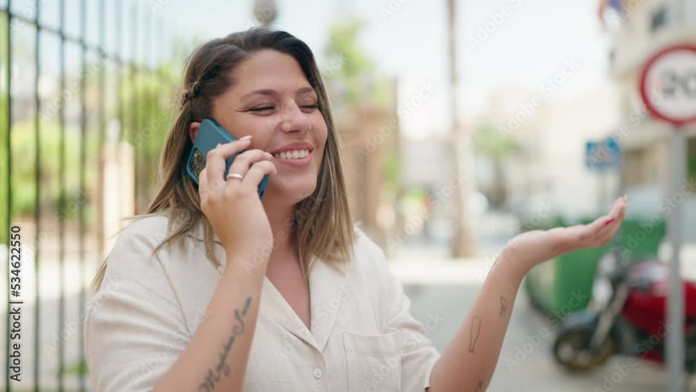 Young hispanic woman smiling confident talking on the smartphone at street Young hispanic woman smiling confident talking on the smartphone at street