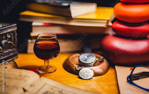 still life with books and sweet wine from portugal