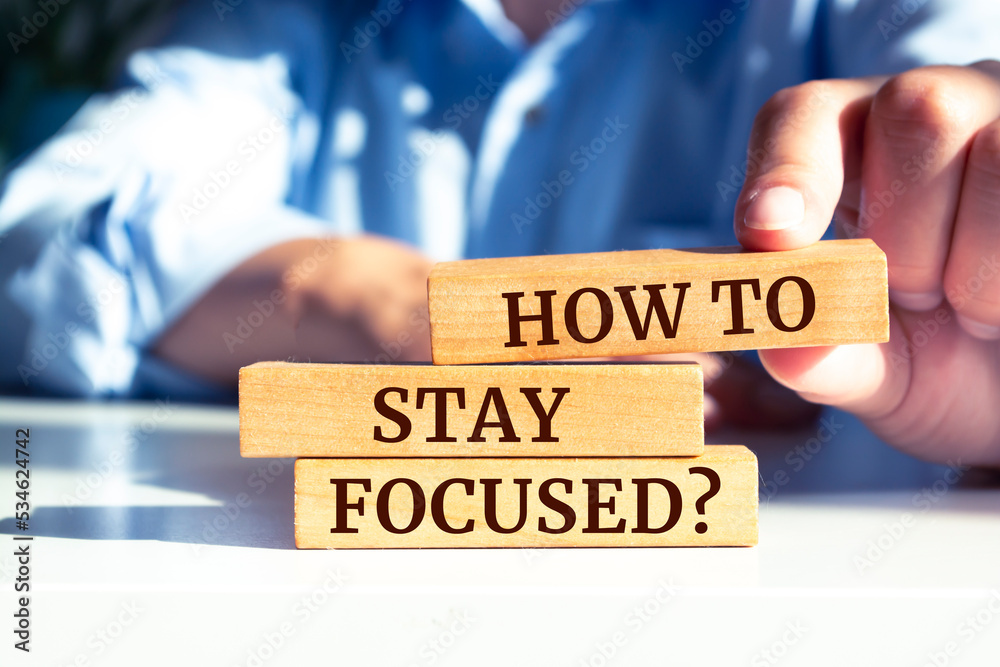 Wooden blocks with words 'How To Stay Focused?'. Wooden blocks with words 'How To Stay Focused?'.