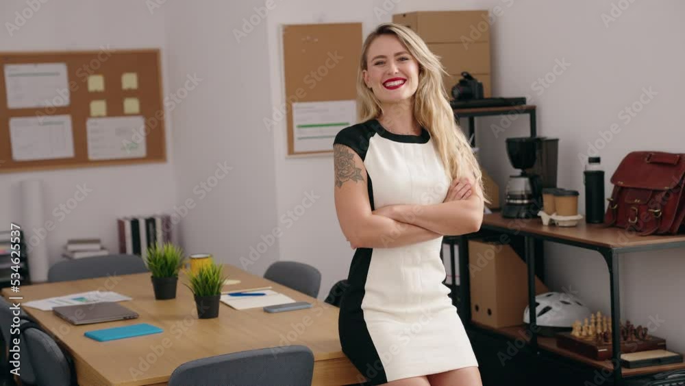 Young beautiful hispanic woman business worker smiling confident standing with arms crossed gesture at office Young beautiful hispanic woman business worker smiling confident standing with arms crossed gesture at office