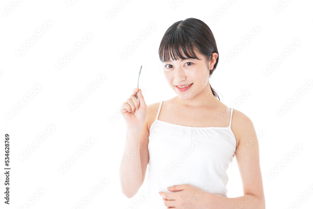 Young woman brushing teeth after shower Young woman brushing teeth after shower