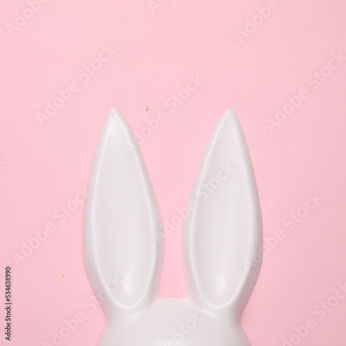 Bunny ears sex shop mask on pink background