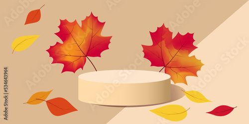 Autumn podium decorated with colorful autumn leaves on a beige background.