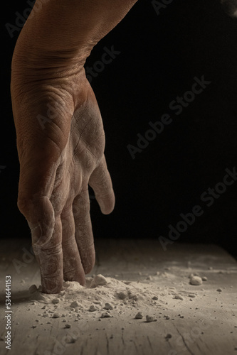 unrecognizable person hand working with flour