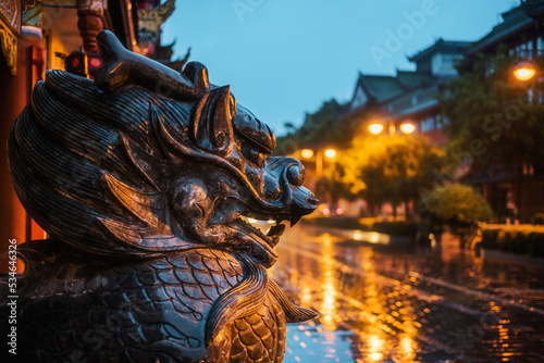 Dragon son bronze statue under the rain at dusk in Qintailu street, Chengdu, Sichuan province, China © LP2Studio
