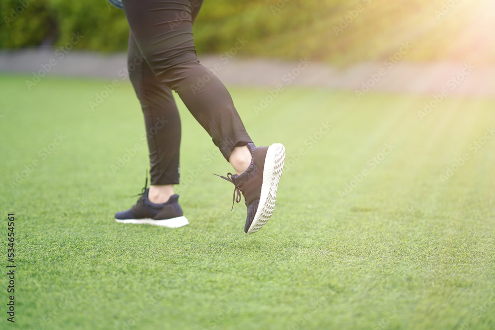 woman run with shoe on lawn