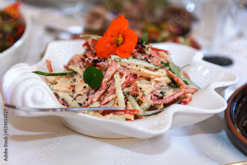 Salad are varied on the festive table. Delicious food to treat guests.