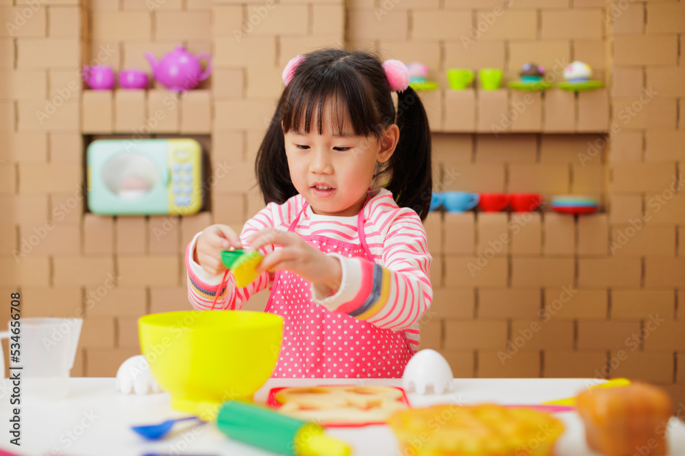 young girl pretend playing food preparing at home young girl pretend playing food preparing at home