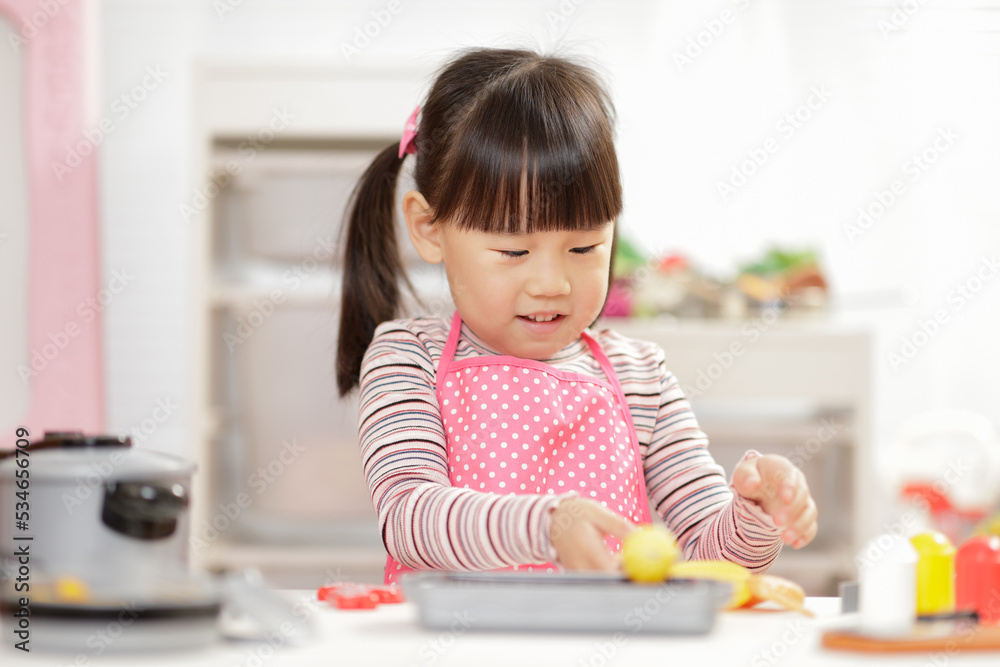 young girl pretend play food preparing at home young girl pretend play food preparing at home