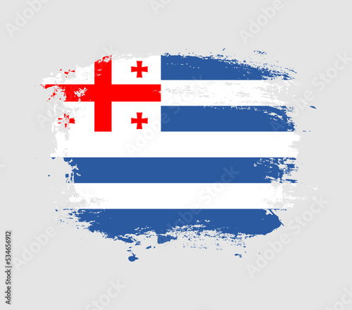 Elegant grungy brush flag with Adjara national flag vector