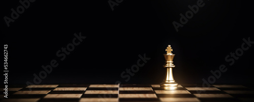 King chess stand on chessboard concept of challenge or team player or business team and leadership strategy or strategic planning and human resources organization risk management. photo